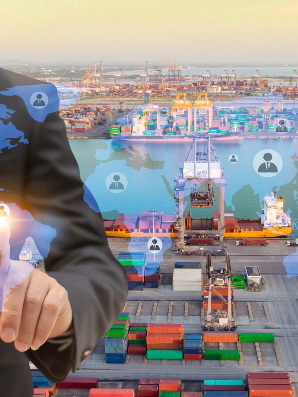 Businessman touching icon people on earth world map for network connection,on Logistics and transportation of International Container Cargo ship in the ocean background,Transportation, Shipping.